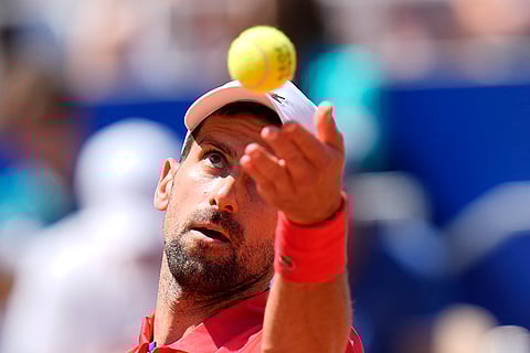 Novak Djokovic serves the ball to Rafael Nadal